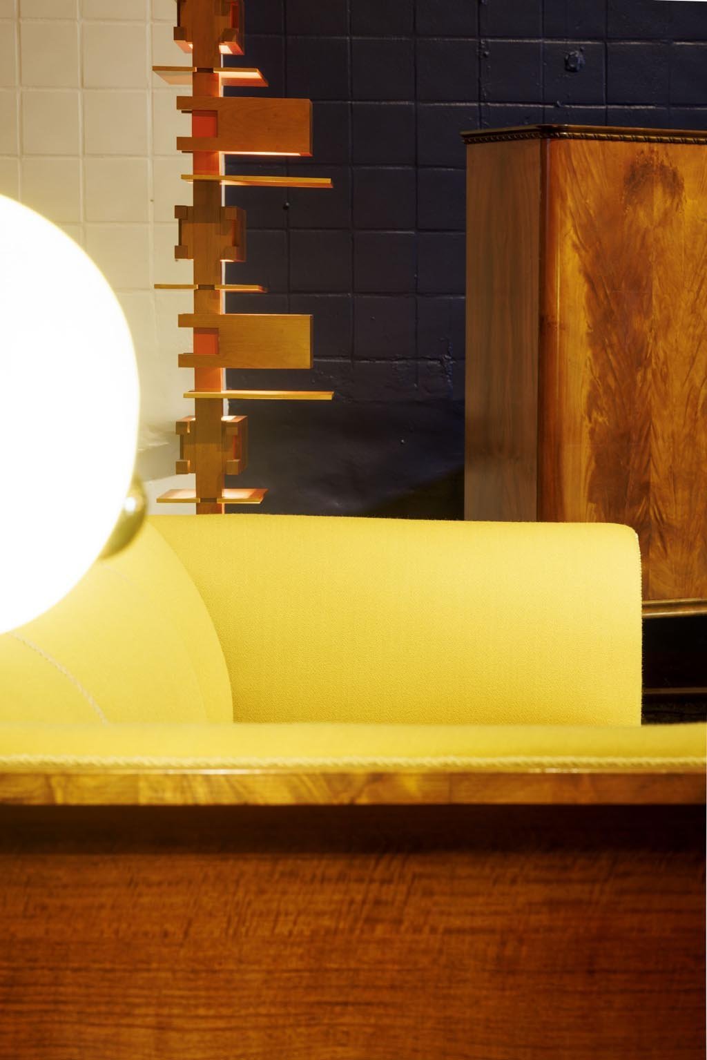 behind the sofa: Floor lamp "Talisien", 1930 by Frank Lloyd Wright, solid cherry